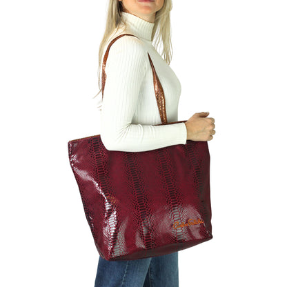 Close-up of the vegan Python Tote's textured, eco-friendly cork accents and stitched handles from a slightly elevated angle.