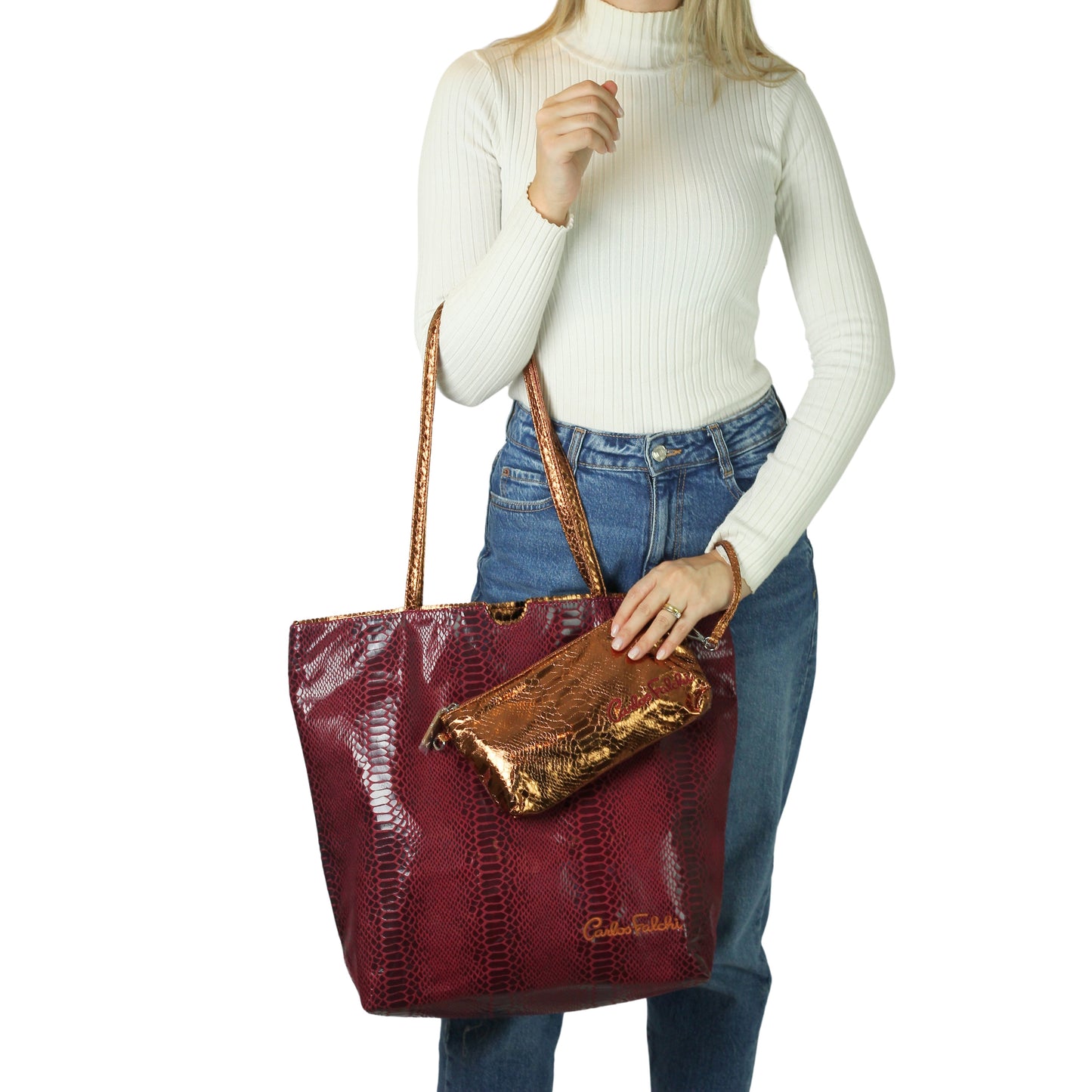 Close-up of the vegan python tote’s textured faux leather surface with visible stitching and a subtle embossed logo detail.