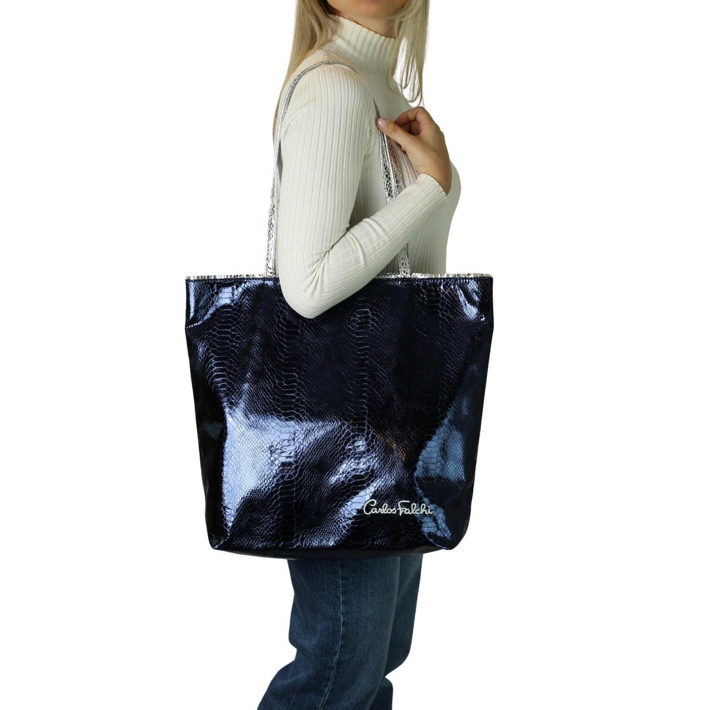 Close-up of the vegan Python Tote’s textured recycled canvas surface with a visible stitched handle detail and vibrant teal