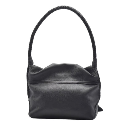 Close-up of the shoulder butterfly bag's textured distressed leather surface with gold-tone zipper pull detail and subtle