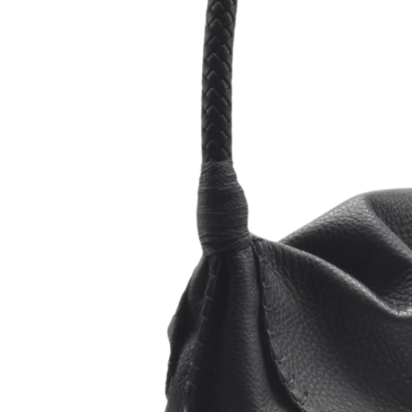 Close-up of the Shoulder Butterfly Bag’s textured beige leather surface with subtle stitching details and a visible