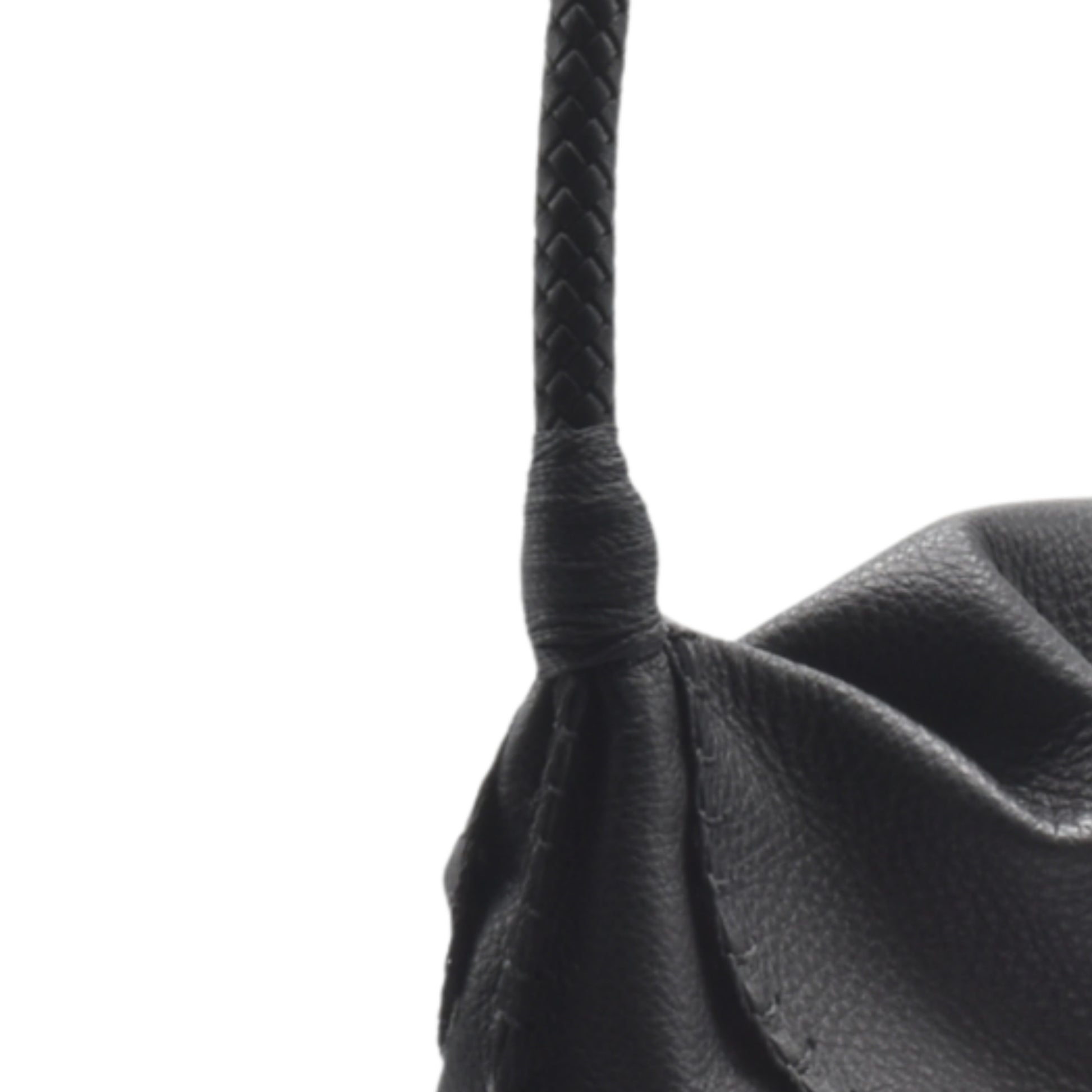 Close-up of the Shoulder Butterfly Bag’s textured beige leather surface with subtle stitching details and a visible