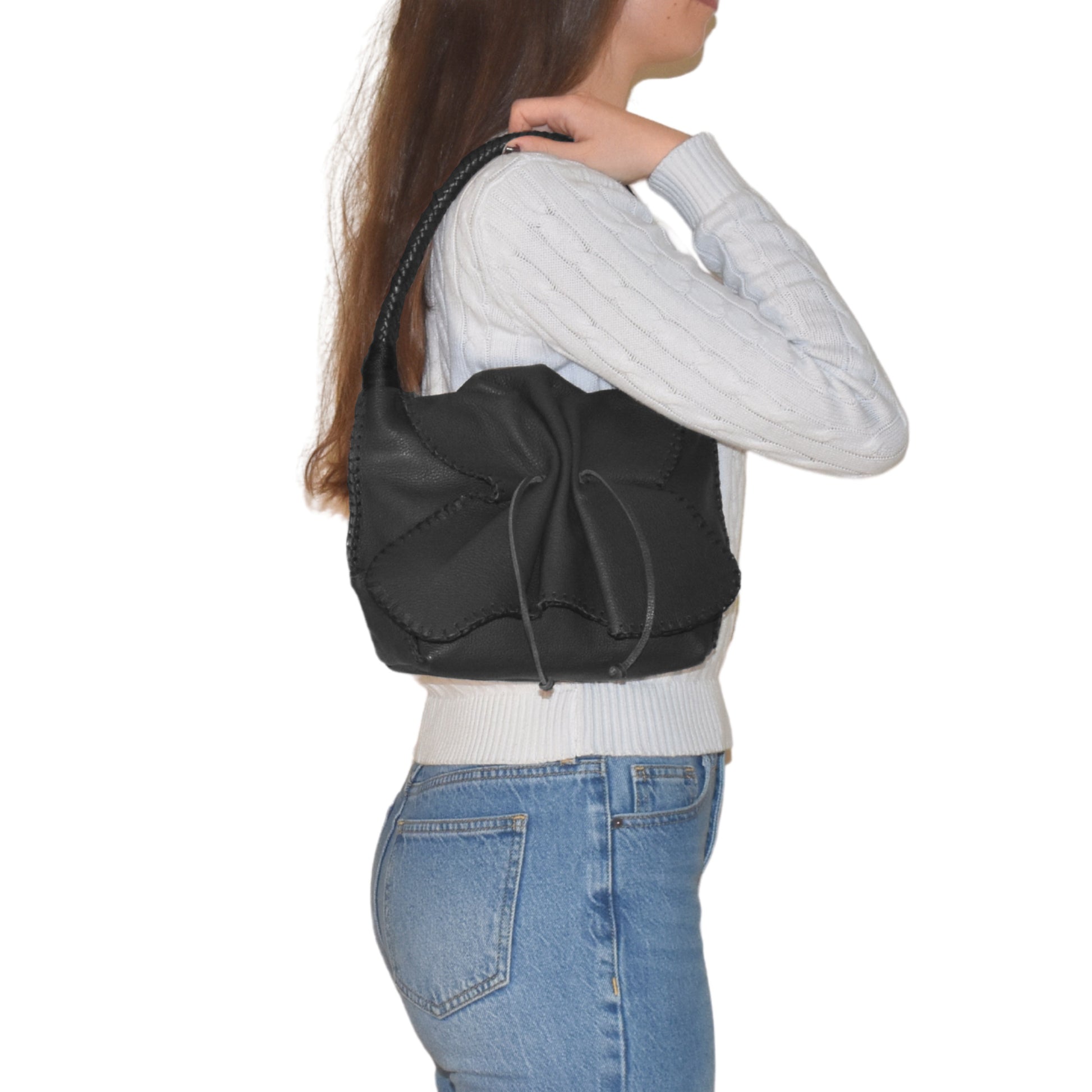 Close-up of the Shoulder Butterfly Bag’s textured beige leather flap with silver-tone hardware and subtle stitching details.