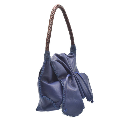 Close-up of the shoulder strap attachment with reinforced stitching and metallic hardware detail on the Butterfly Bag.