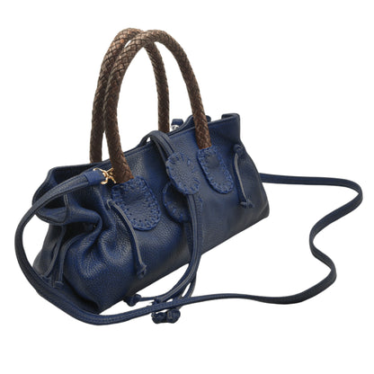 Mini satchel front zipper pocket detail with textured pebble leather and subtle gold-tone hardware accents.