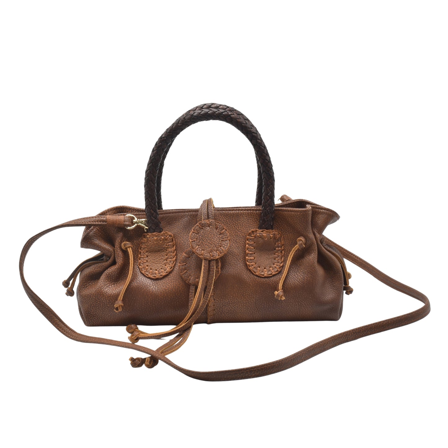 Close-up of textured faux leather surface with visible stitching and subtle grain detail on the mini satchel's front pocket