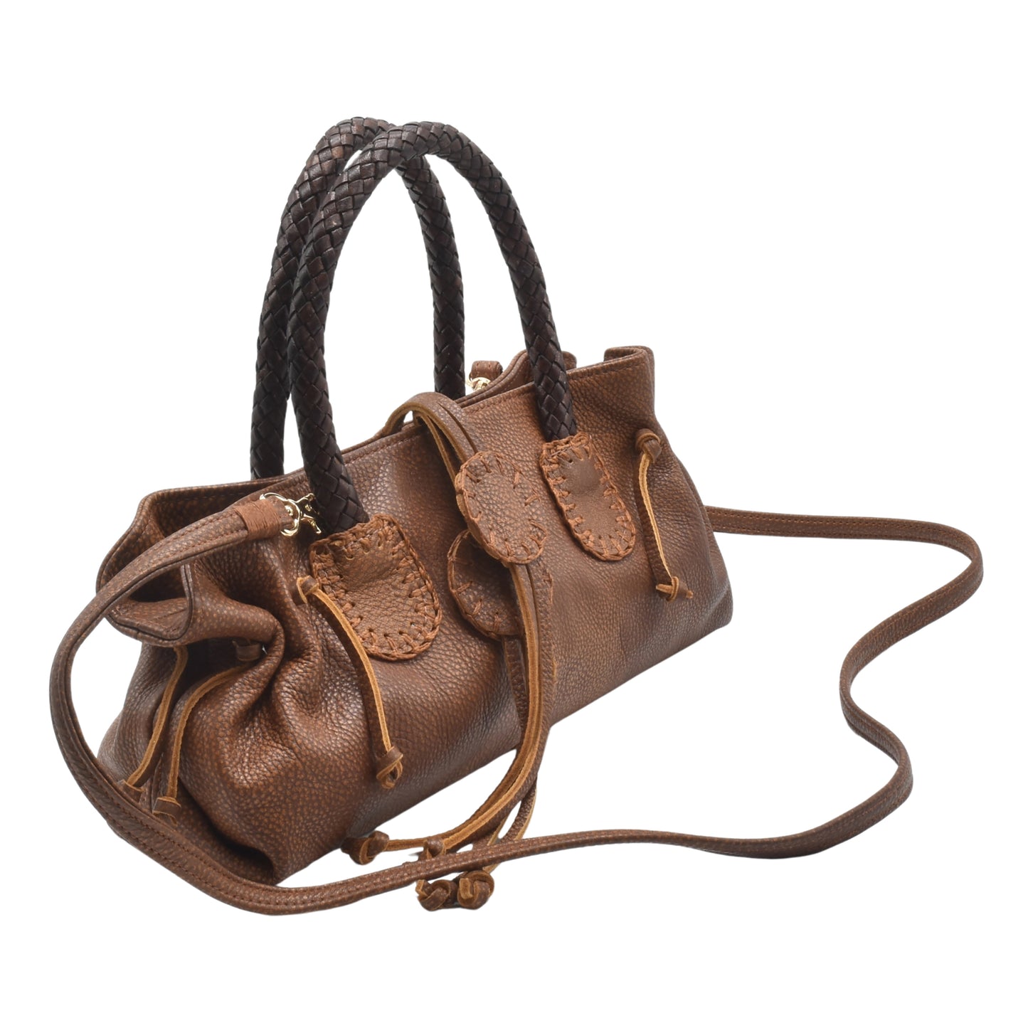 Close-up of the textured caramel-colored leather surface highlighting precise stitching and subtle grain details.