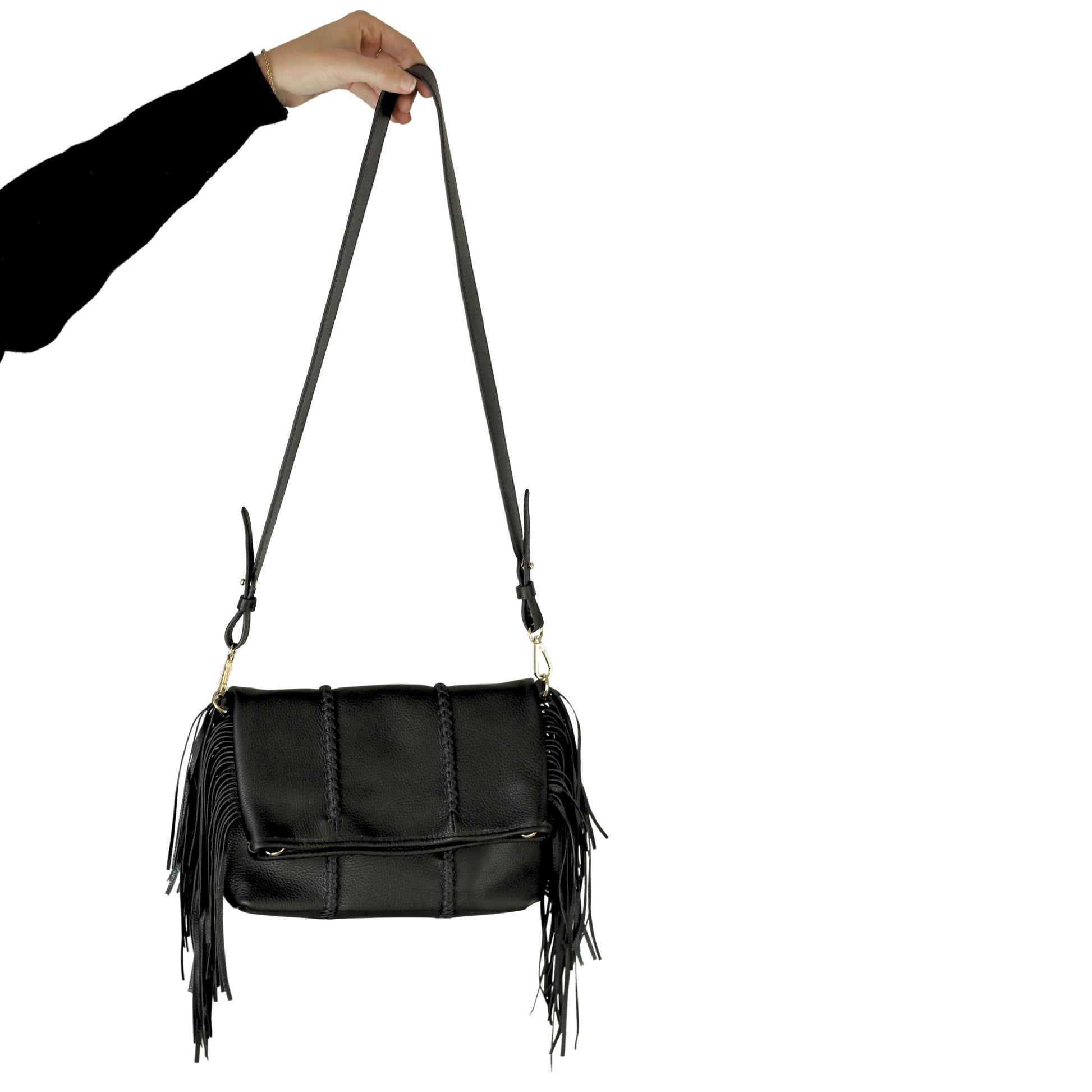 Close-up of the large fringed crossbody strap featuring Antique Brass metal links and detailed tassel fringe at a slight