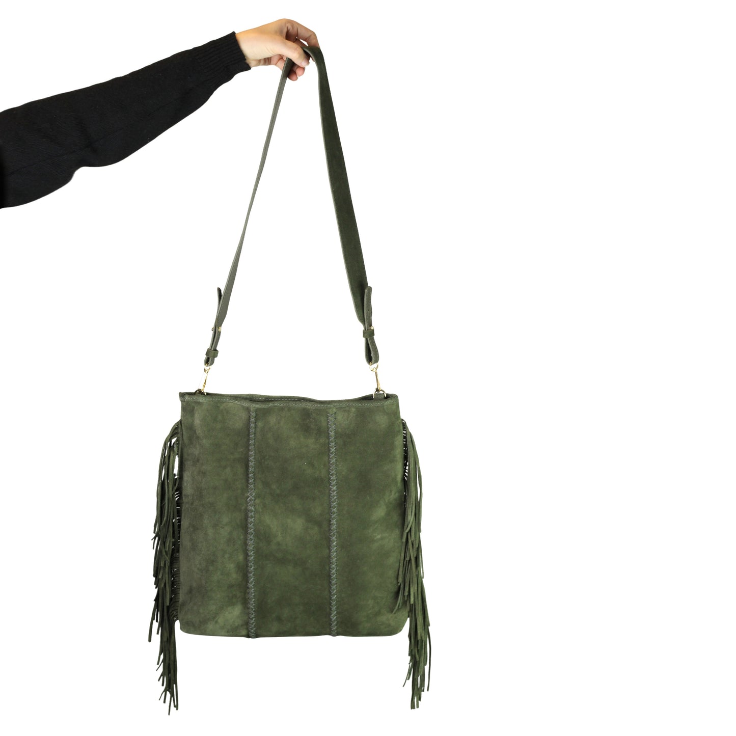 Close-up of the large fringe tassel detail with textured leather strap and silver-tone metal clasp on the crossbody