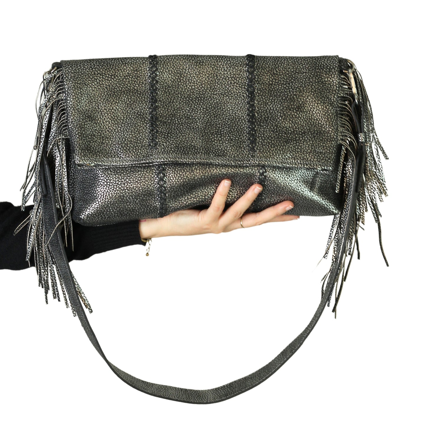 Close-up of the Large Fringe Crossbody Messenger's textured leather flap with metal buckle and intricate fringe detailing