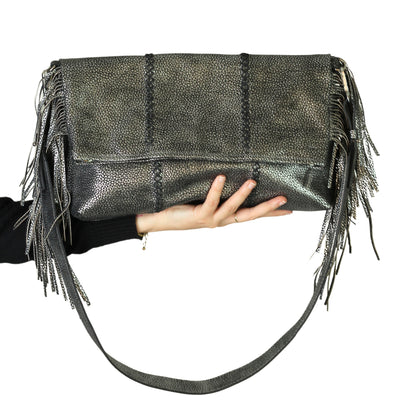 Close-up of the Large Fringe Crossbody Messenger's textured leather flap with metal buckle and intricate fringe detailing