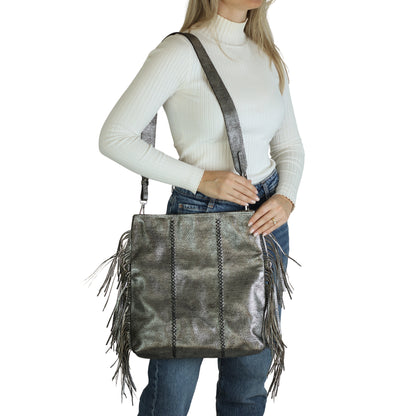 Close-up of the Large Fringe Crossbody Messenger's clasp featuring matte brass plating and intricate chain link details from