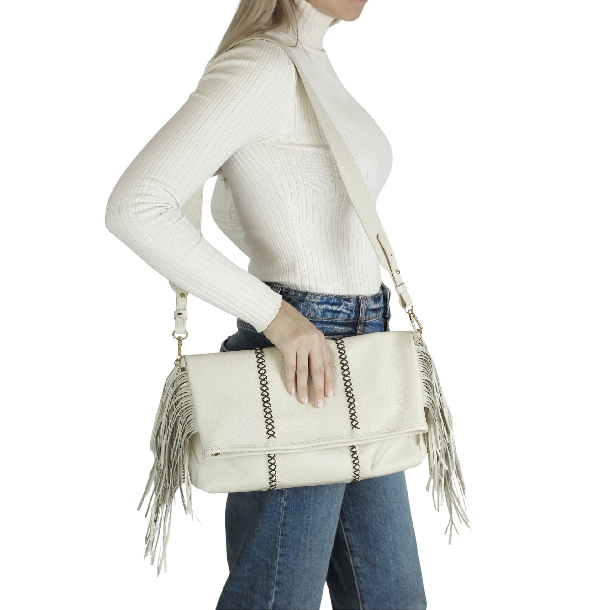 Close-up of the large fringe leather crossbody strap showcasing detailed stitching and layered fringe texture from an angled