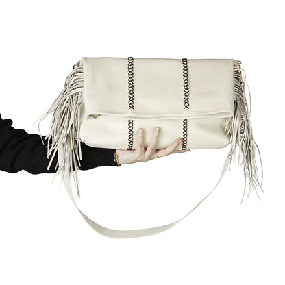 Close-up of the large fringe leather crossbody strap showing detailed stitching and layered tassels from a front-side angle