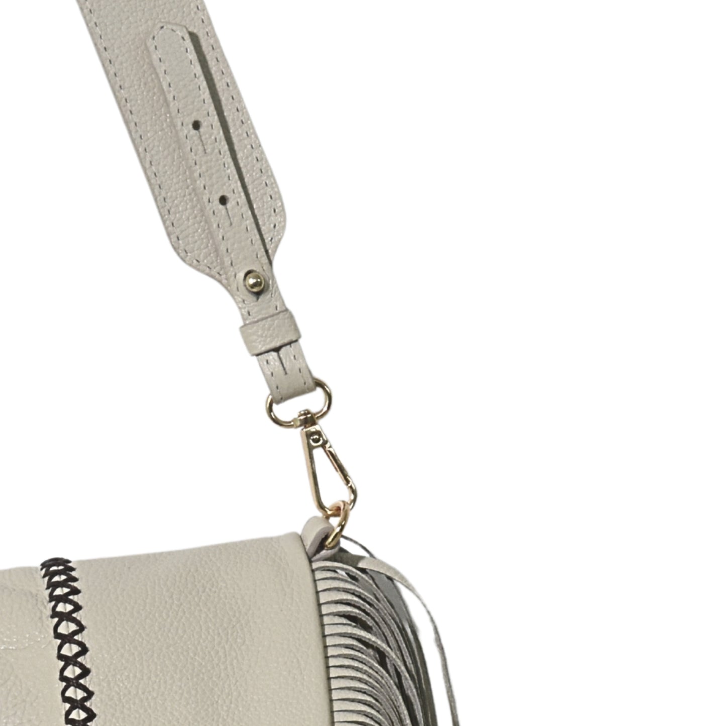 Close-up of the large fringe leather strap with silver-tone metal accents and layered chain detail on the messenger body.