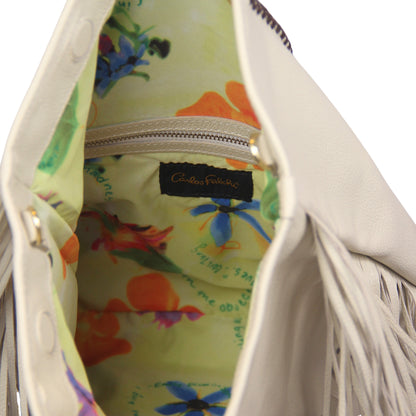 Close-up of the large gold-tone chain with fringed leather detailing, highlighting the textured metallic finish and layered