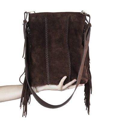 Close-up of the fringe crossbody strap revealing intricate chain links and textured metal plating from a front-facing angle