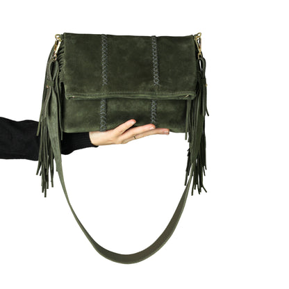 Close-up of the Fringe Crossbody Messenger’s gold-tone chain strap showing textured links and lobster clasp detail from a