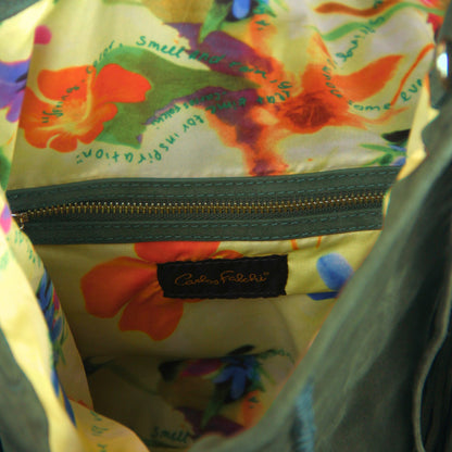 Close-up of the Fringe Crossbody Messenger's textured bronze metal chain with lobster clasp attachment and intricate fringe