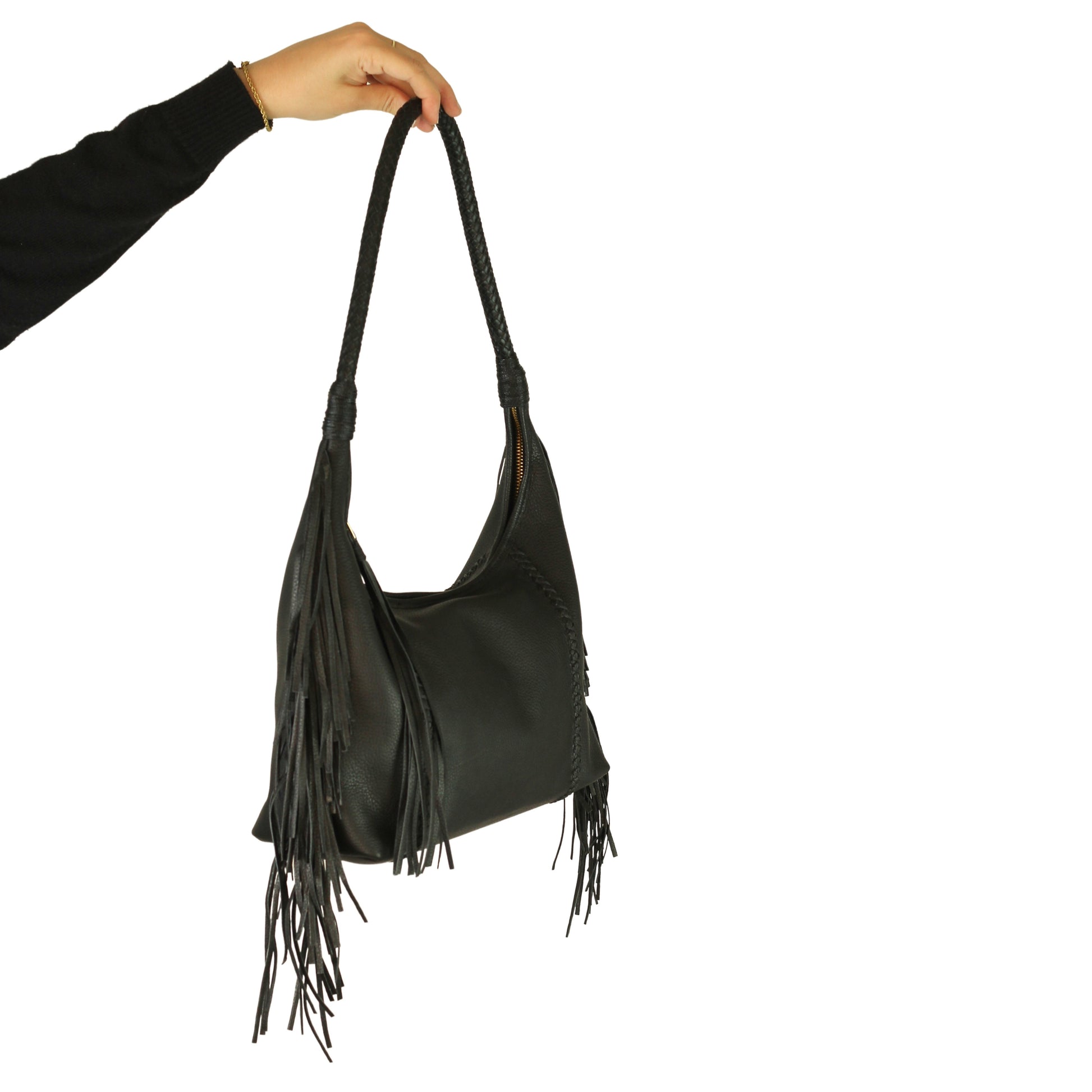Close-up of the Fringe Hobo Bag’s antique brass chain with intricate filigree detailing and textured finish, emphasizing