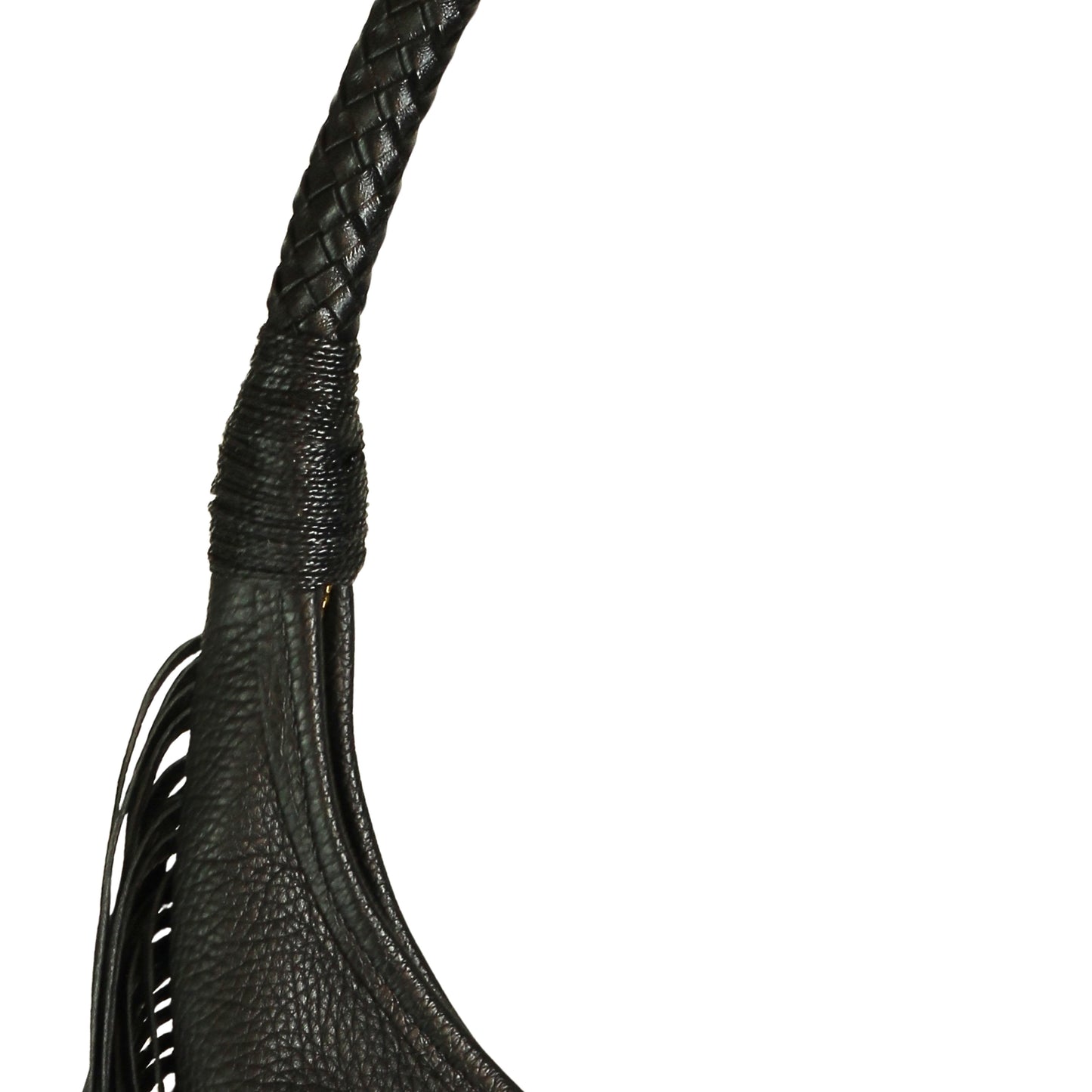Close-up of the fringe detail and textured leather surface displaying layered tassels on the front of the hobo bag.