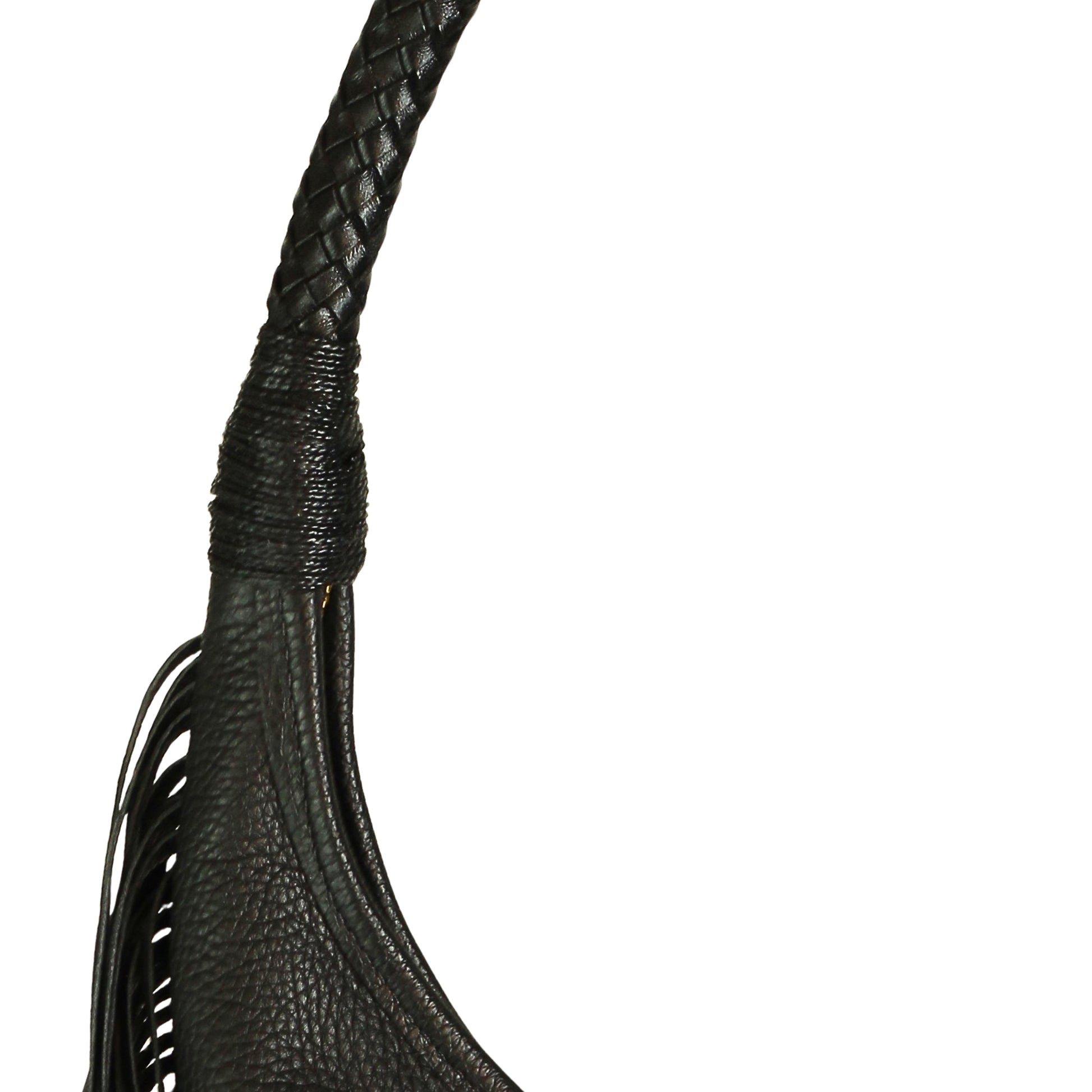 Close-up of the fringe detail and textured leather surface displaying layered tassels on the front of the hobo bag.
