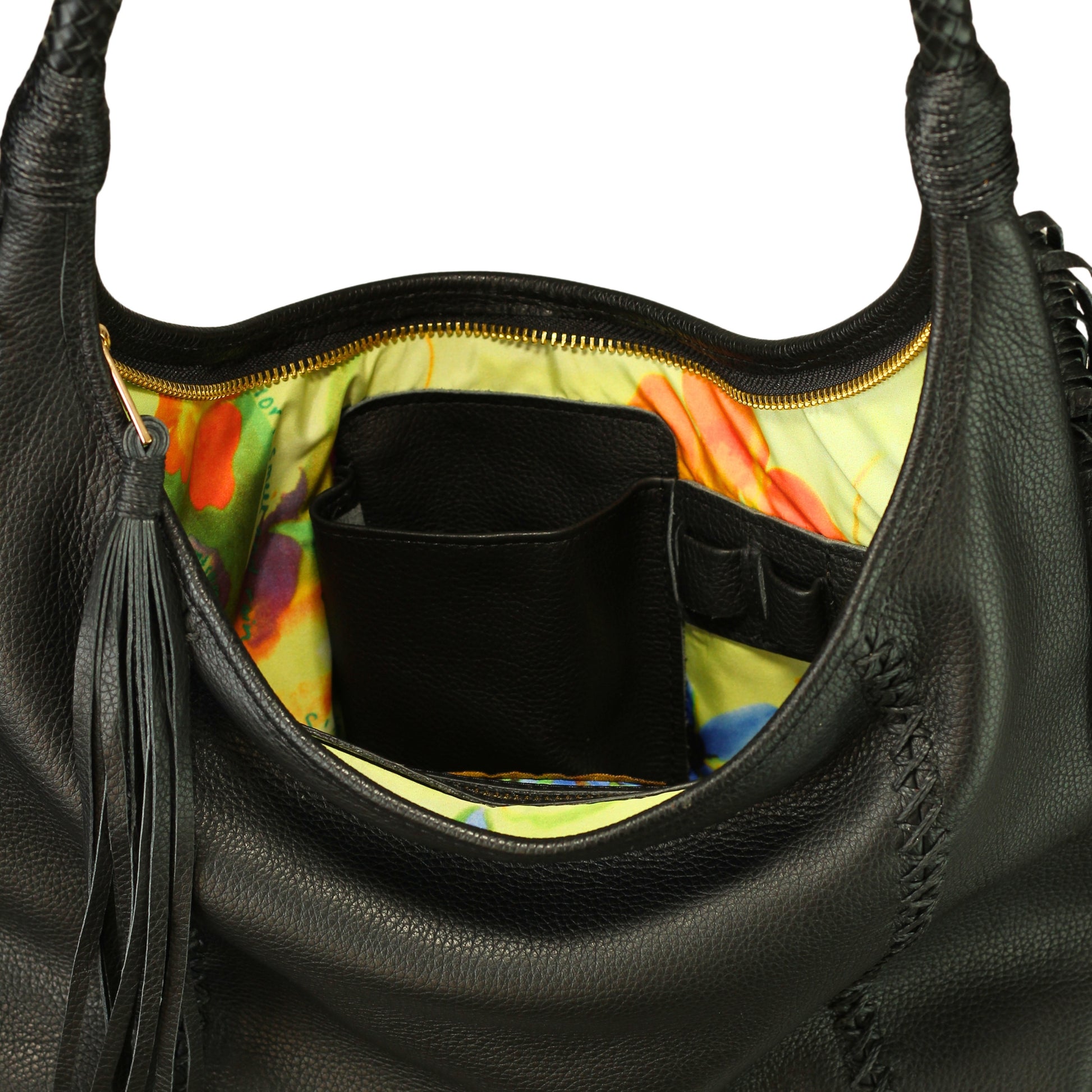 Close-up of the Fringe Hobo Bag’s textured leather surface highlighting intricate fringe stitching and subtle metallic sheen