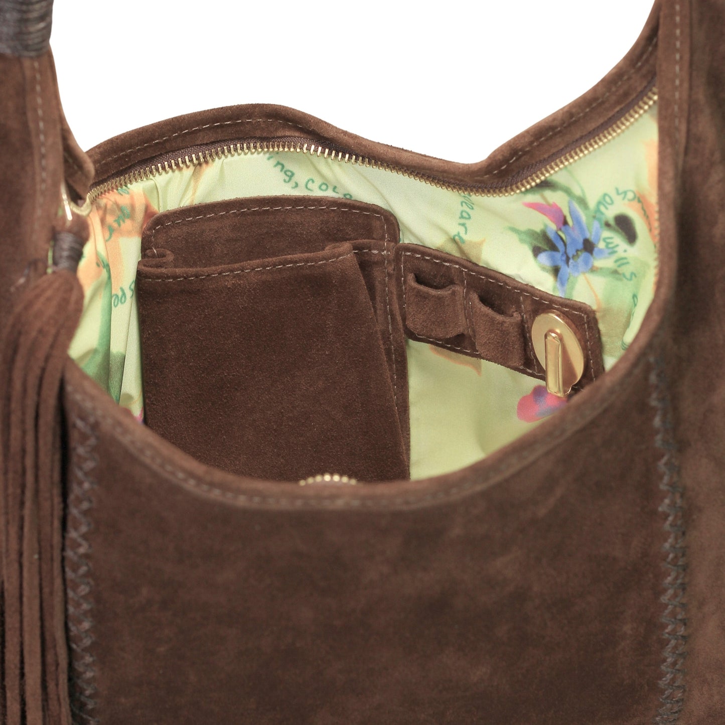 Close-up of the fringed leather detailing on the front flap, highlighting the rustic texture and hand-stitched accents.