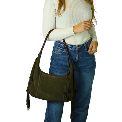 Close-up of the fringed leather tassel detail and chain attachment showcasing craftsmanship and texture.