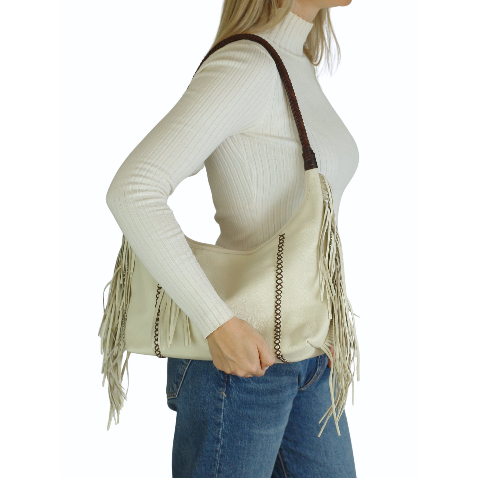 Close-up of the fringed leather exterior highlighting detailed craftsmanship and textured tassel accents on the Fringe Hobo