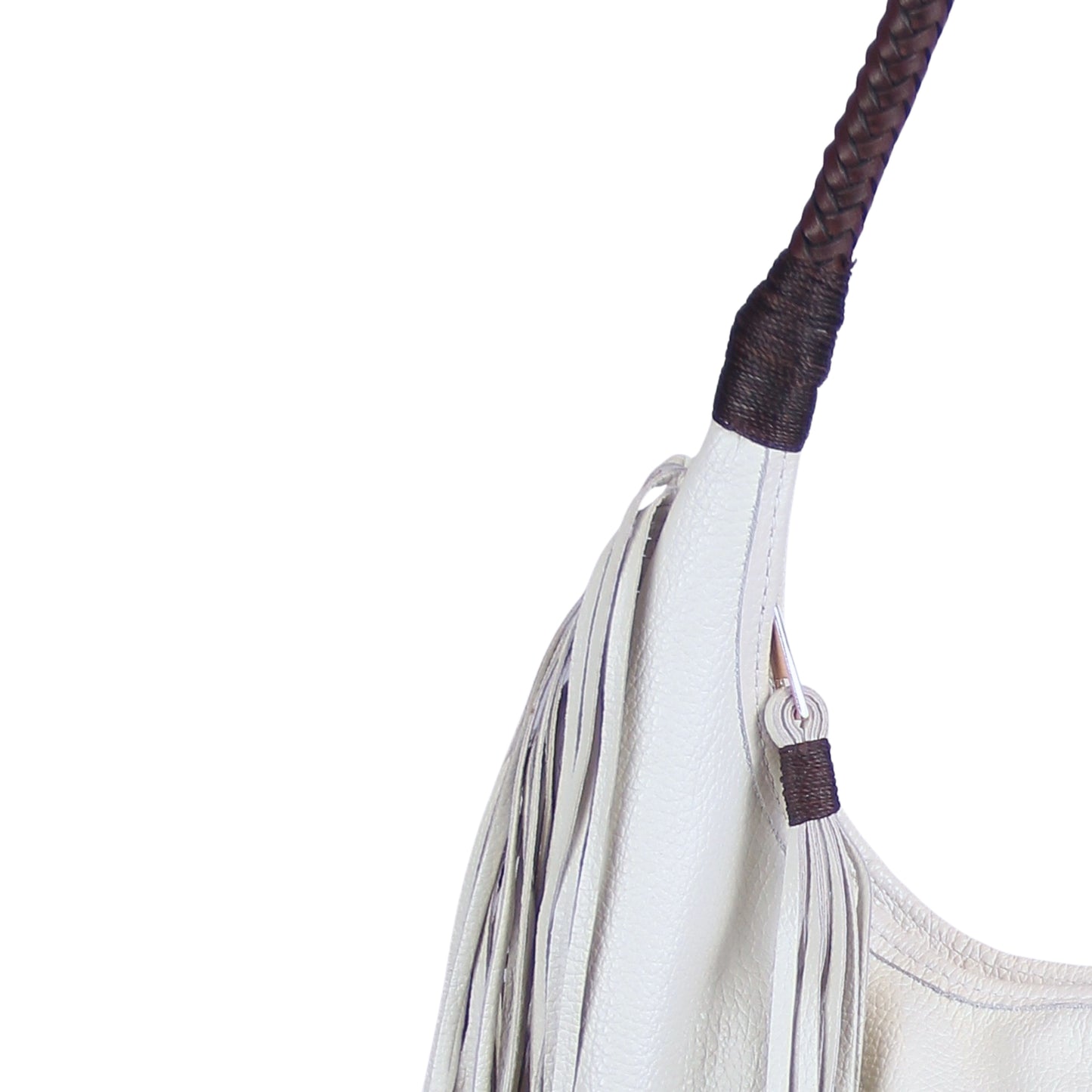 Close-up of the fringed leather texture and metal rivet detailing on the fringe hobo bag's side panel from a diagonal angle.