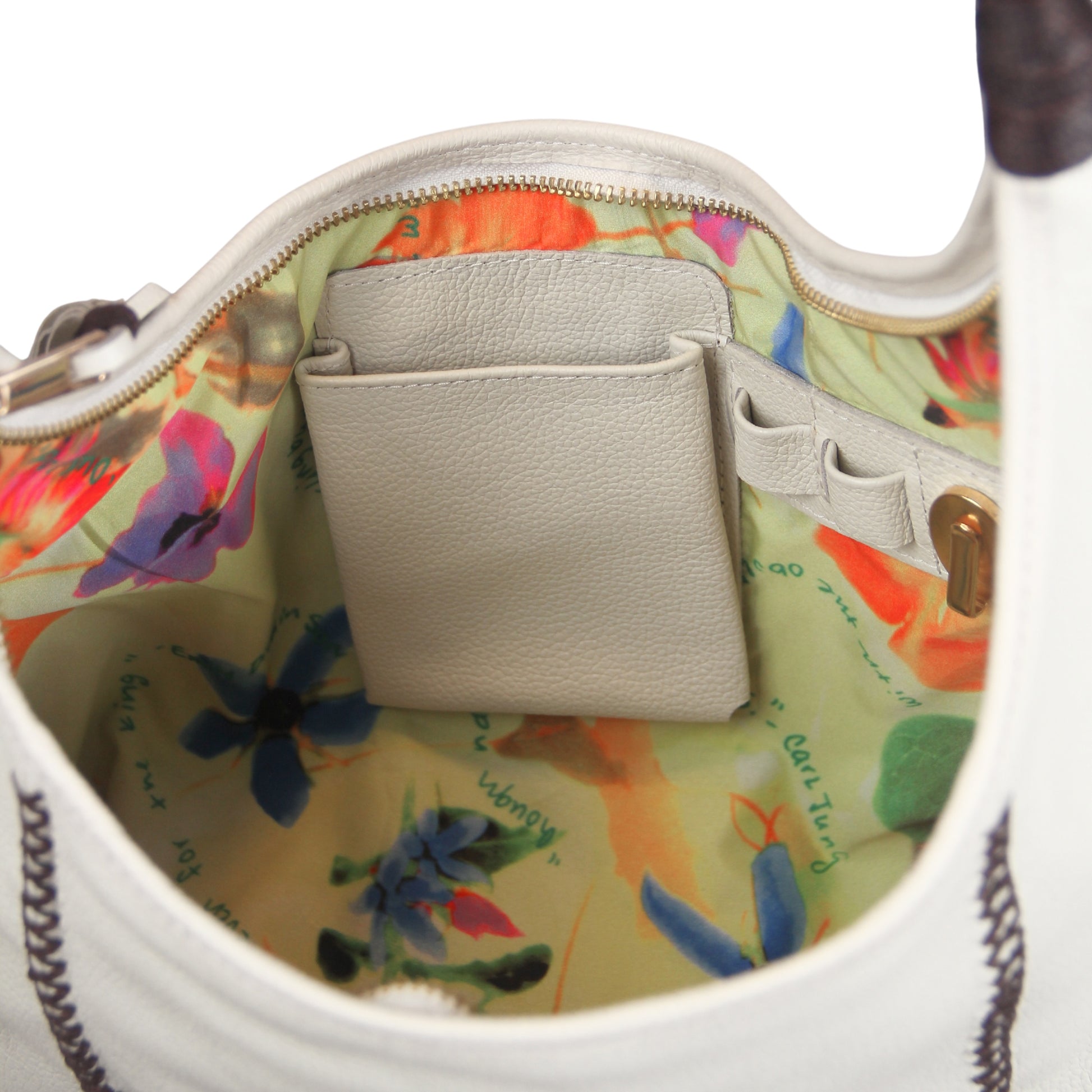 Close-up of gold-toned metal chain strap with textured fringe detail and subtle gemstone accents on the Fringe Hobo Bag.